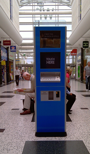 This 2 metre tall kiosk, comes with lower interactive 19'' display and a second, higher passive 19'' display for advertising purposes. At the rear of the unit a large passive of interactive third screen could replace the static advertisment area.